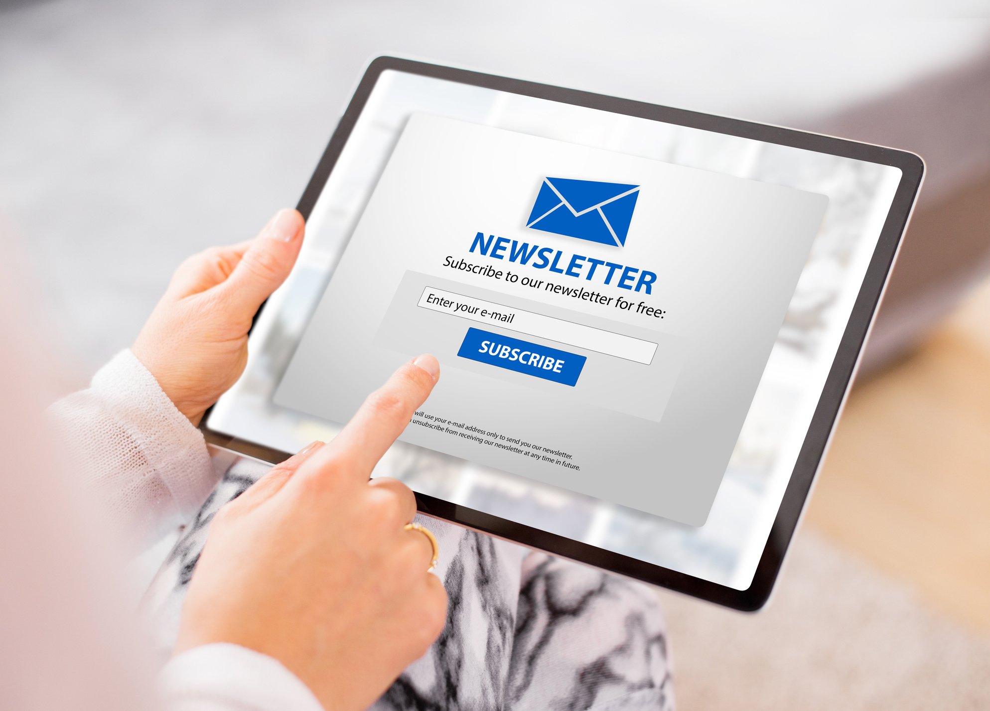 Woman subscribing to newsletter online